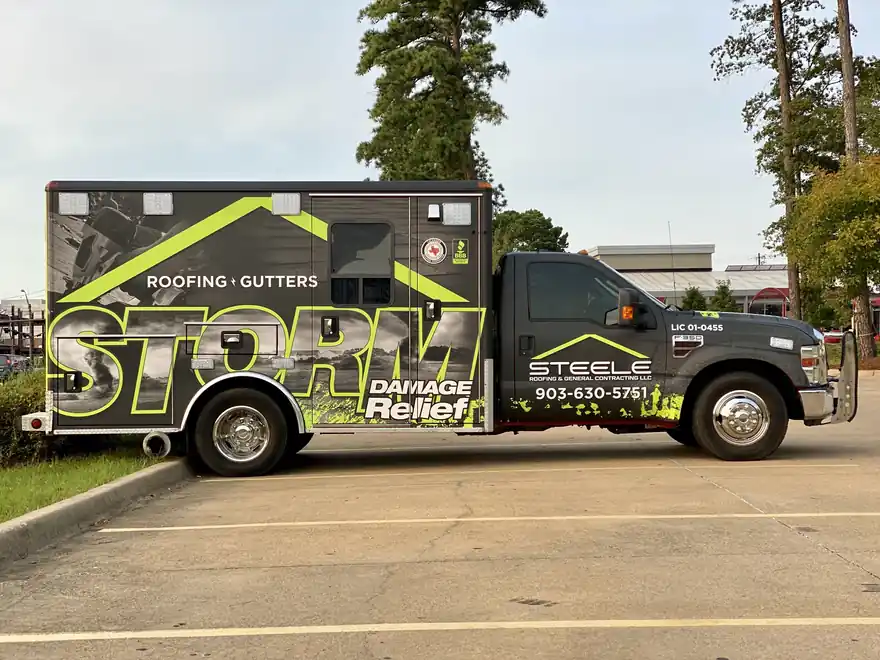 The black STORM Damage Relief box truck in lime-green livery